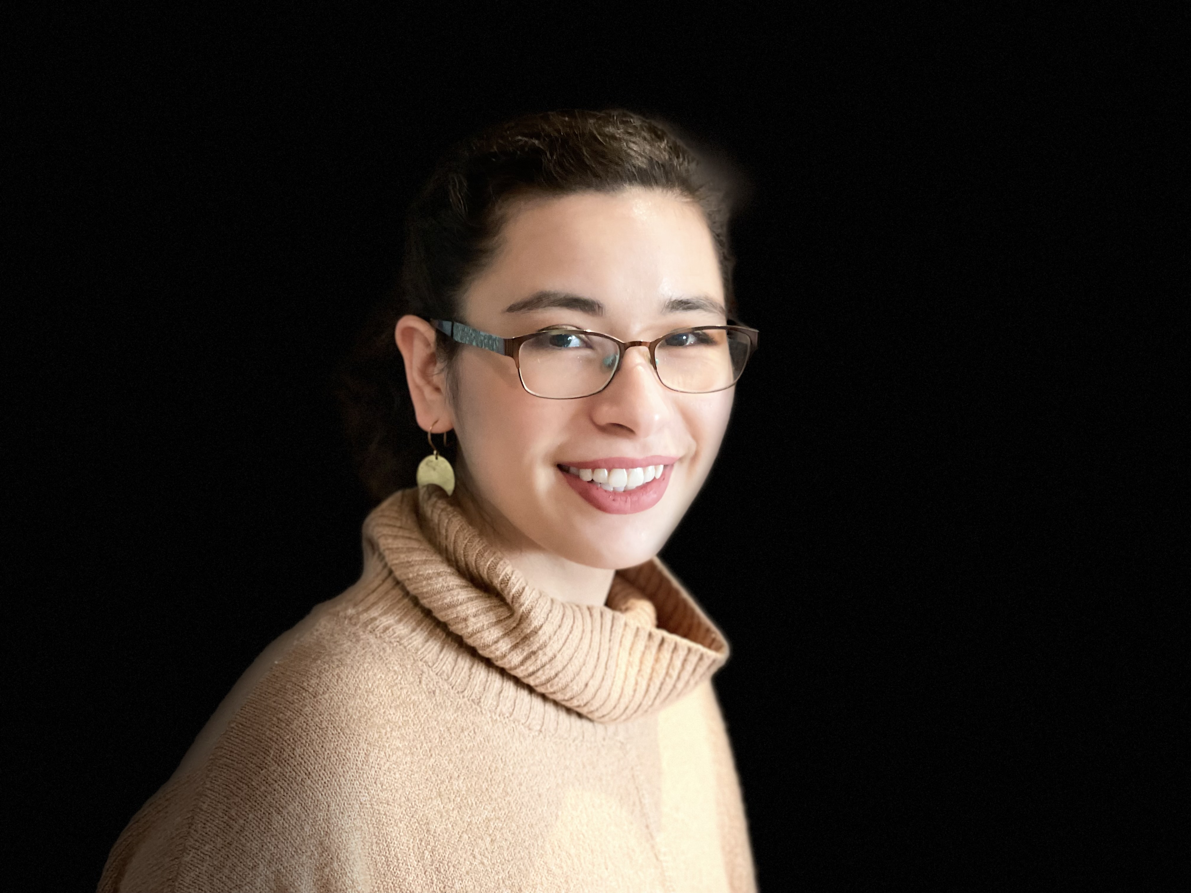 Photographic headshot of Indigo
